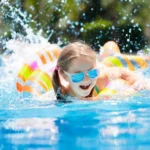 Child swimming in a residential swimming pool