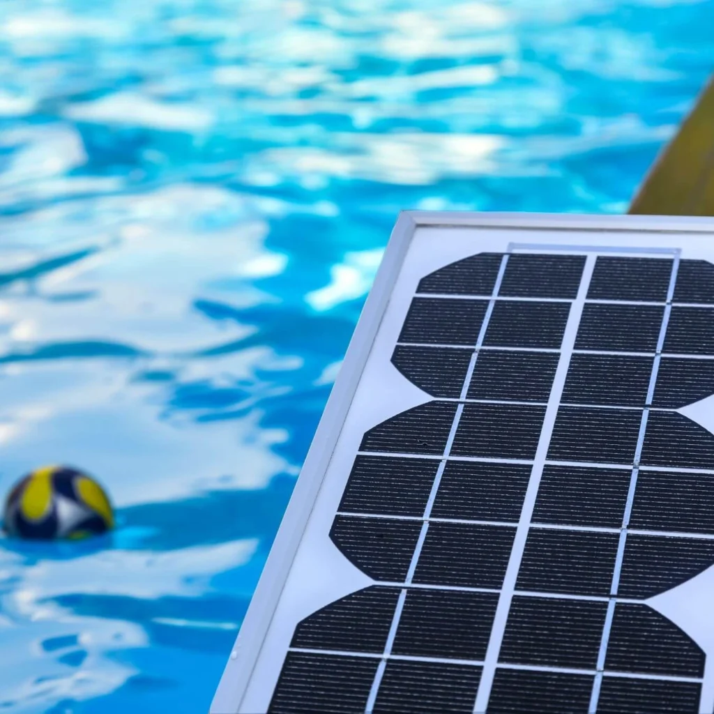 Solar panel beside a backyard swimming pool in Florida